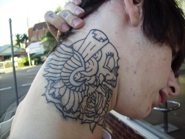 Skull and flower neck tattoo
