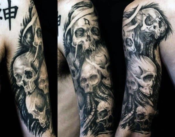 Skulls on mens arm tattoo