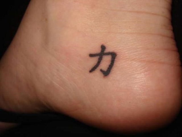 Small strength symbol tattoo on heel