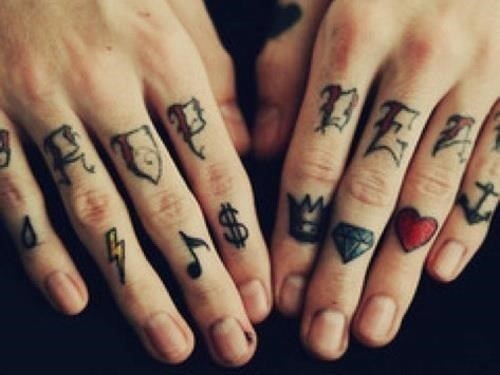 Small symbols and finger tattoos