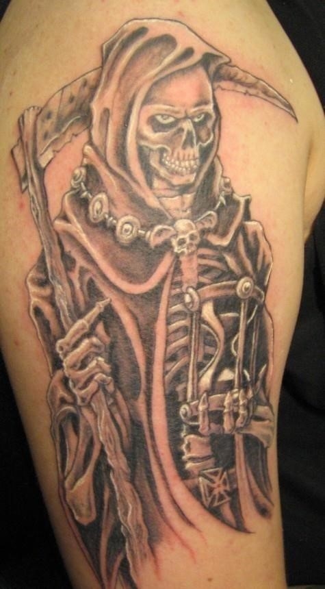 Smiling grim reaper tattoo