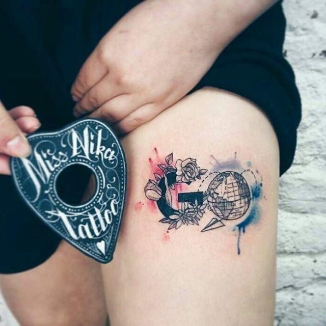 Stylish travel globe tattoo