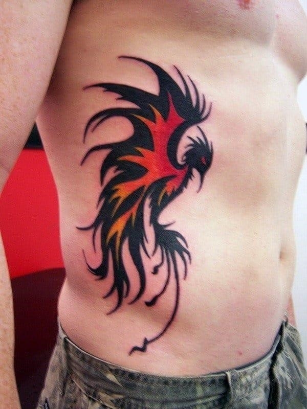 Tribal flaming phoenix mens rib cage side tattoos