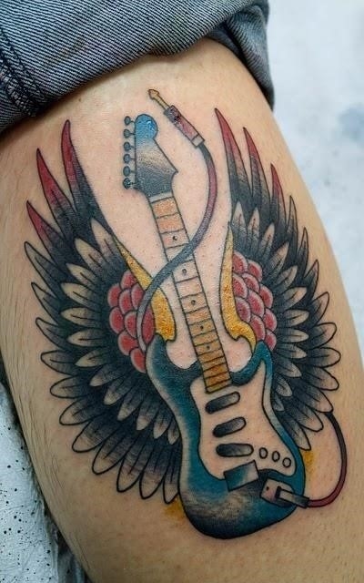 Winged guitar tattoo for men