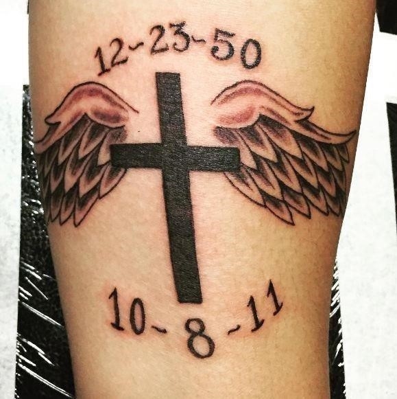 Wings and cross memorial tattoos